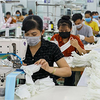 Workers produce anti-bacterial masks Workers produce anti-bacterial masks